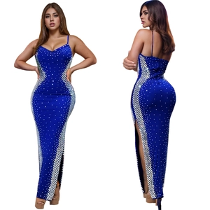 Detail showing royal blue sequin dress with rhinestone patterns and side slit