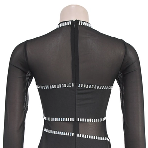 Detail view of black mesh dress back showing sparkling silver rhinestones and zipper