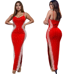 Detail of red bodycon dress with sequin geometric pattern and high side slit