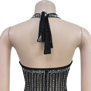 Detailed back view of a black backless halter top with shimmering silver rhinestones