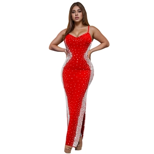 Detail of red floor-length dress with sparkly rhinestone patterns and side slit