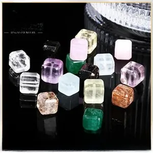 Close-up of mixed natural stone cube beads including amethyst and rose quartz for DIY jewelry