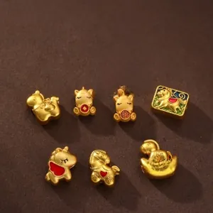Detailed view of gold horse zodiac charms with red enamel and lucky symbols for DIY jewelry