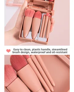 Detail of pink makeup brush set with storage case featuring a built-in mirror and soft bristles