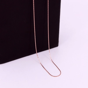 Close-up of minimalist rose gold square link chain necklace in medical grade 316L steel