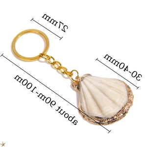 Detail showing shell dimensions: 30-40mm width and 90-100mm total length with gold ring