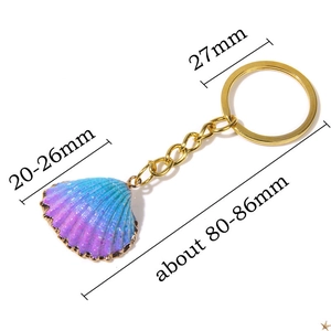Golden natural shell keychain with purple and blue gradient shell pendant and glitter finish