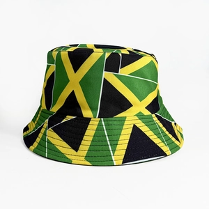 Reversible bucket hat with green, yellow and black geometric pattern for sports fans