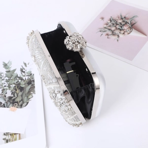 Elegant silver evening clutch bag with handmade beads, crystal decor and floral clasp