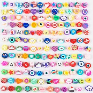 Colorful mixed polymer clay beads with smiley faces, hearts and stars for DIY jewelry making