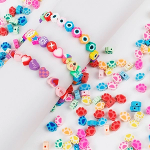 Handmade rainbow polymer clay bead set with heart, star, and cat paw shapes for DIY jewelry