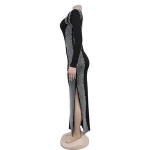 Detail view of black bodycon dress with side silver rhinestone geometric patterns and slit