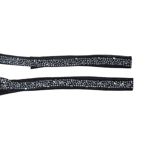 Detail of elegant black fabric belts featuring intricate sparkling rhinestones and beadwork