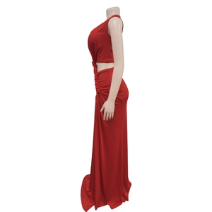 Detail of red sleeveless maxi dress with side cut-out and pleated waist design