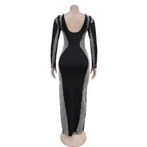 Macro view of backless design and geometric diamond pattern on black long sleeve dress