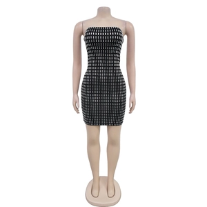Detail of black bodycon tube dress featuring silver rectangular rhinestone patterns