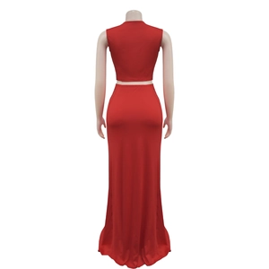 Back view of a red sleeveless crop top and high-waisted floor-length fishtail skirt set