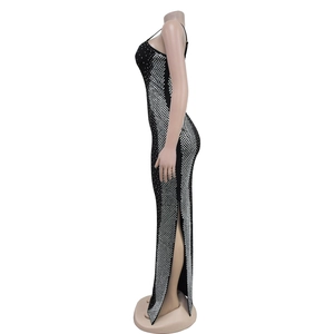 Detailed side view of black fishtail dress with silver sequins and high side slit