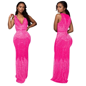 Detail of hot pink bodycon evening dress featuring V-neck and radiant rhinestone pattern