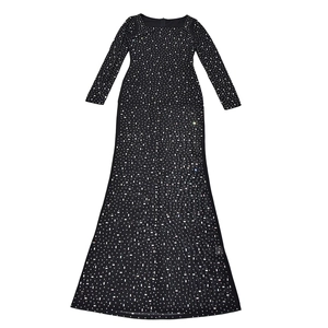 Detail of black long sleeve maxi dress featuring sparkling rhinestone embellishments