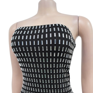 Detail of black tube top featuring silver rhinestone rectangles in a grid pattern