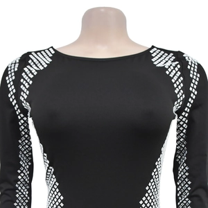 Detailed view of black long-sleeve dress with geometric silver square sequin embellishments