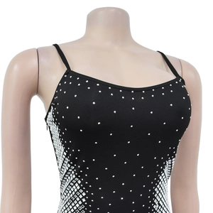Close-up of sparkling silver rhinestones and V-neck detail on black bodycon dress