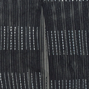 Detail of black pleated mesh fabric with sparkling silver rhinestones and sequins