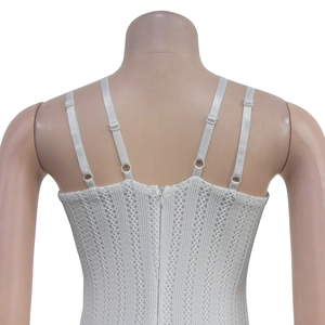 Close-up of white crochet camisole featuring four spaghetti straps and back hidden zipper
