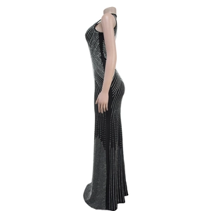 Detail of elegant black fitted dress featuring radiating silver rhinestones for evening wear