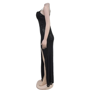 Detailed view of black sequin maxi dress featuring thin straps and a high side slit