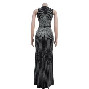 Back view of a black sleeveless maxi dress featuring intricate white rhinestone patterns