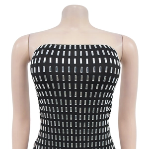 Detailed view of black backless dress featuring a geometric silver rhinestone grid pattern