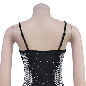 Close-up of black spaghetti strap top with silver geometric rhinestones and side zipper