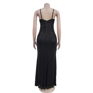 Detail view of shimmering black sequin fabric and invisible back zipper on the gown