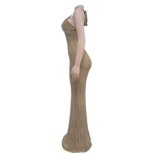 Detail of khaki sleeveless dress with pearl neckline and vertical rhinestone stripes