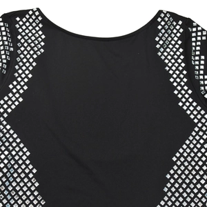Detail of black dress neckline featuring shimmering silver square rhinestones in lines