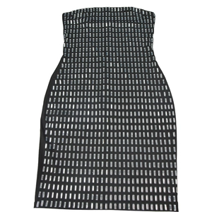 Detail of black bodycon tube dress featuring shiny silver rectangular rhinestone accents