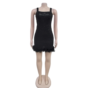 Detail of black sequin mini dress featuring elegant feather trim and square neckline