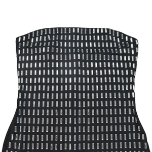 Close-up of black backless dress with silver rectangular rhinestones in a grid pattern