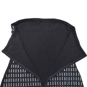 Detail of black knit dress featuring silver rectangular sequins and zipper closure