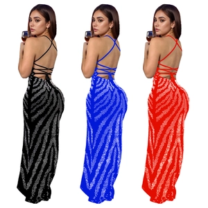 Detailed comparison of backless halter dresses in black, blue, and red with rhinestone patterns