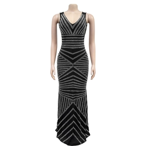 Detailed view of black sleeveless maxi dress featuring intricate silver rhinestone patterns