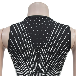 Detail of black dress with sparkling silver rhinestones in geometric radial pattern
