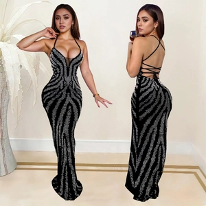 Sleeveless black backless evening dress with silver sequins and cross strap design