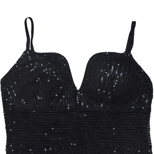 Detail showing high-quality black sequins with a deep V-neck and thin shoulder straps