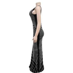 Detailed side view of black sleeveless evening gown with geometric silver rhinestones