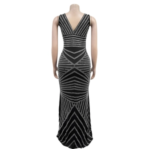 Detail of the deep V-back design on a black bodycon dress with silver rhinestones