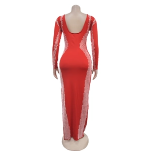 Detail view of red slim-fit dress featuring deep U-back design and white diamond patterns