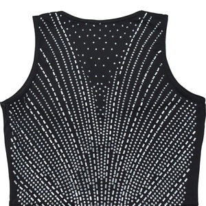 Detailed close-up of intricate silver rhinestone V-shaped pattern on a black sleeveless top